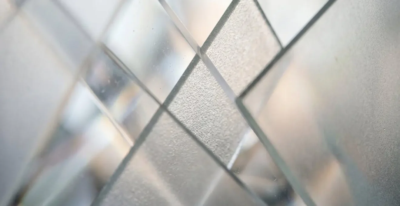 Macro photograph of overlapping transparent glass layers creating visual complexity and fragmentation